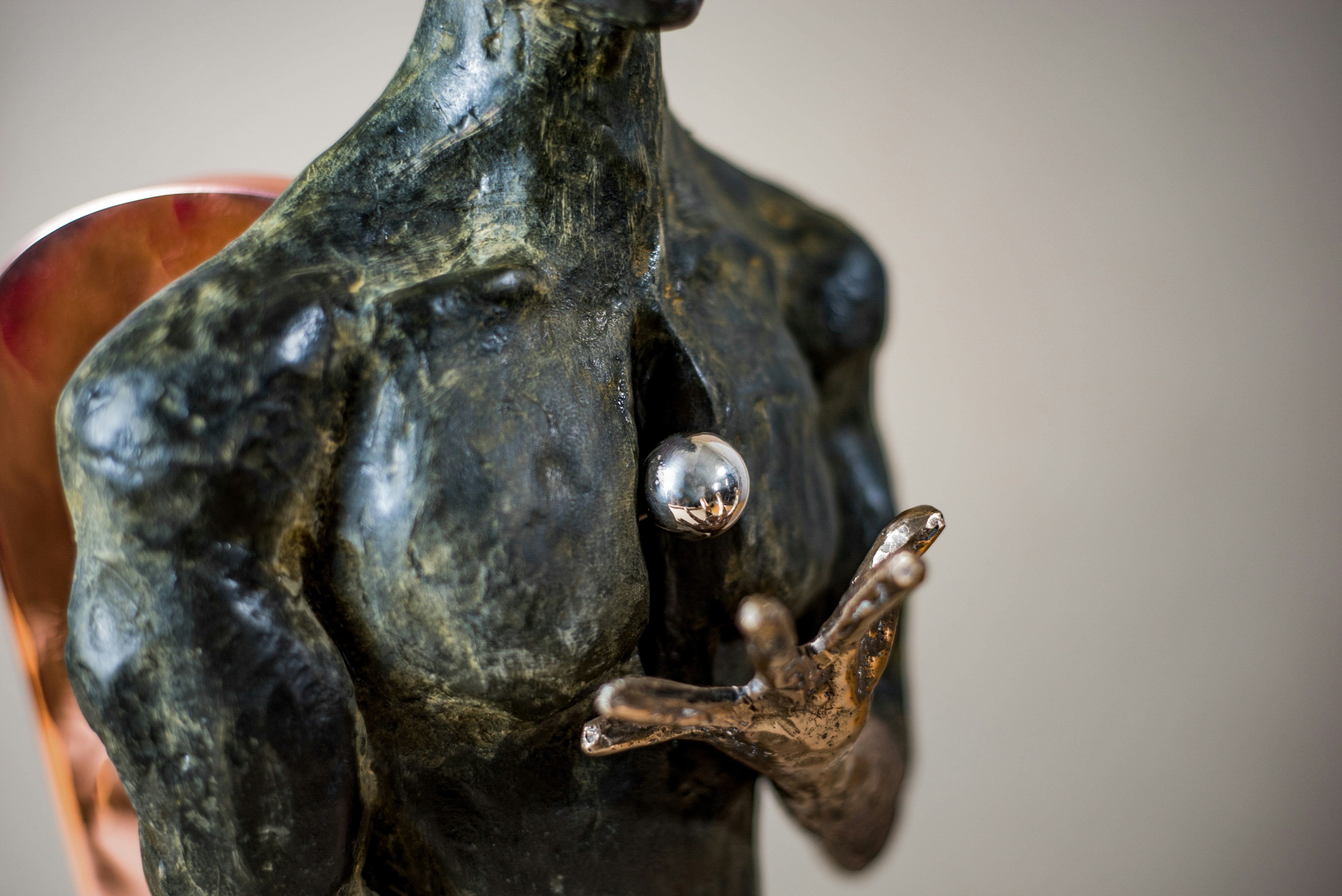 black ceramic figurine on white table